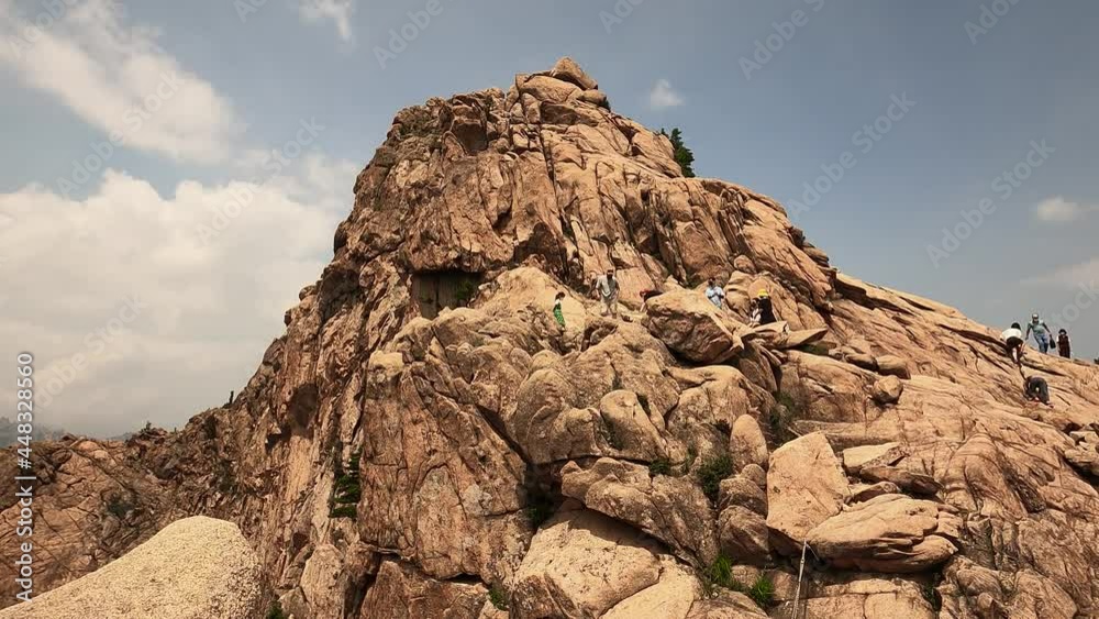 People Climbing On Rugged Mountain In Seoraksan National Park, South Korea. low angle People Climbing On Rugged Mountain In Seoraksan National Park, South Korea. low angle