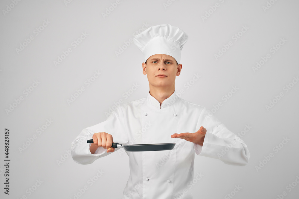 a man in chef's clothes kitchen work is a staff a man in chef's clothes kitchen work is a staff