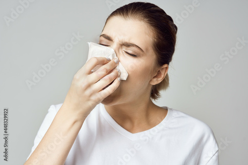 woman in white t-shirt handkerchief cold health problems