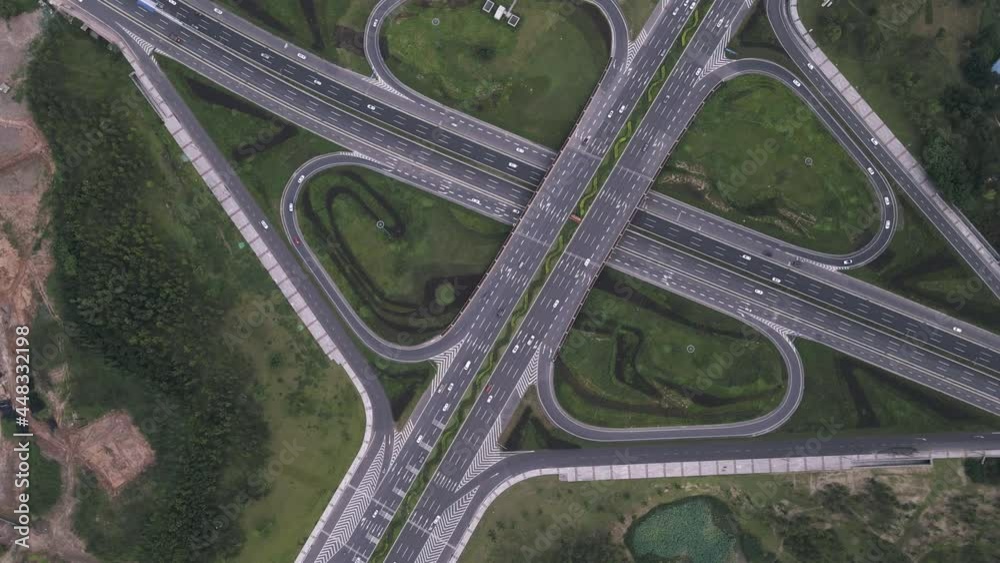 Top down angle aerial of modern multilevel traffic junction elevated
