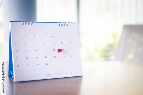 Thumbtack in calendar concept for busy, appointment and meeting reminder.