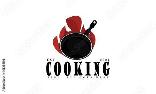 Vintage Retro Rustic Old Cast Iron Frying Pan and fire for traditional food dishes cuisine classic restaurant kitchen logo design