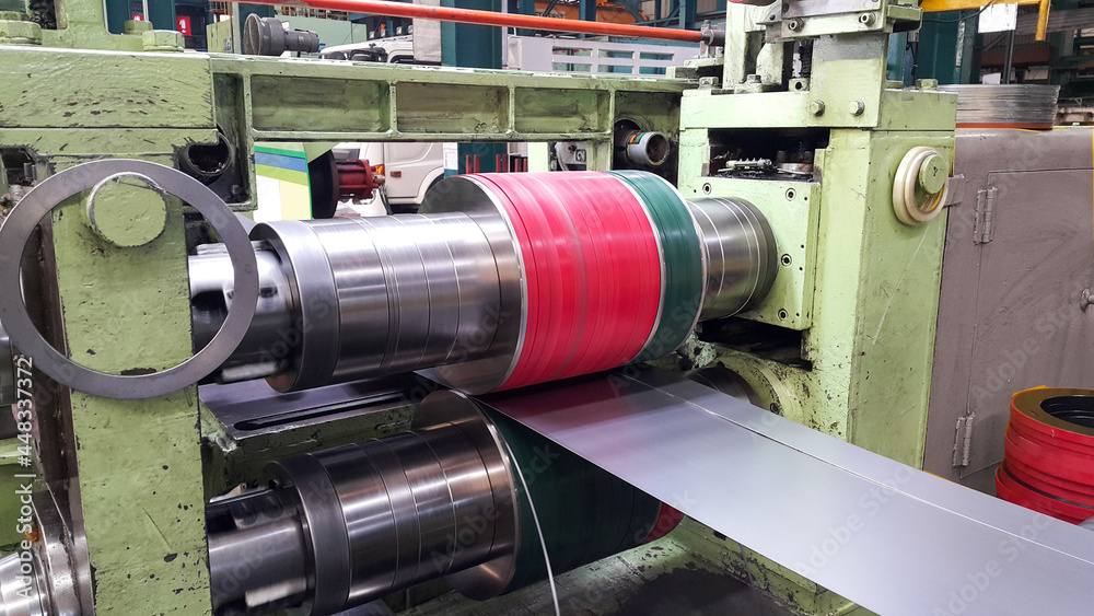 Rolled steel sheet coil slitting process in factory, slitting knife stand - obrazy, fototapety, plakaty 
