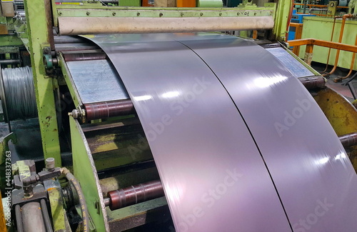 Two Rolled steel sheet coil slitting process in factory photo