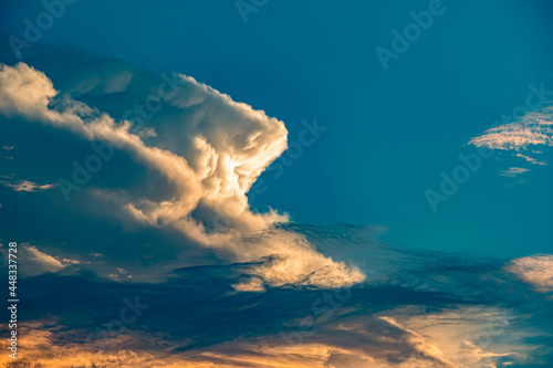 Dramatic clouds in Blue White and Golden
