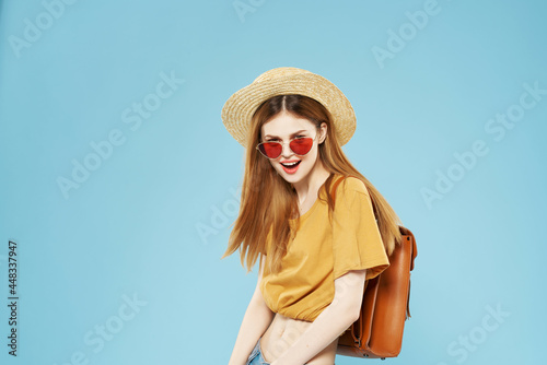 woman in hat bag summer style travel fashion