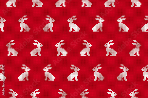 Knit seamless pattern. Red background with rabbits. Holiday knitted sweater texture. Easter traditional print. Festive fair isle ornament. Vector illustration.