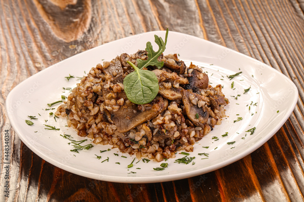 Fototapeta premium Boiled buckwheat with roasted mushrooms