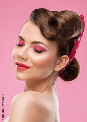 Young beautiful woman with a beautiful hairstyle and bright makeup. Professional makeup and facial care.