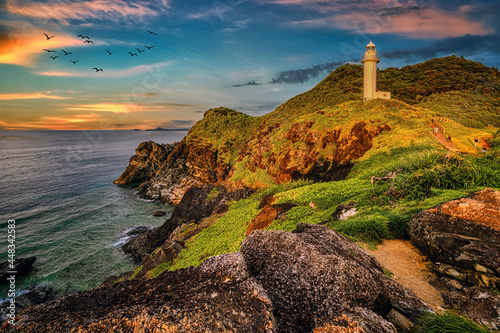 A lighthouse on a cliff on the island of Ishigaki, Okinawa, seen at sunset
