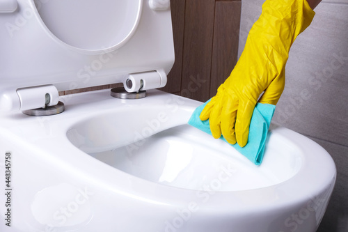 Cleaning  rimless toilet close-up