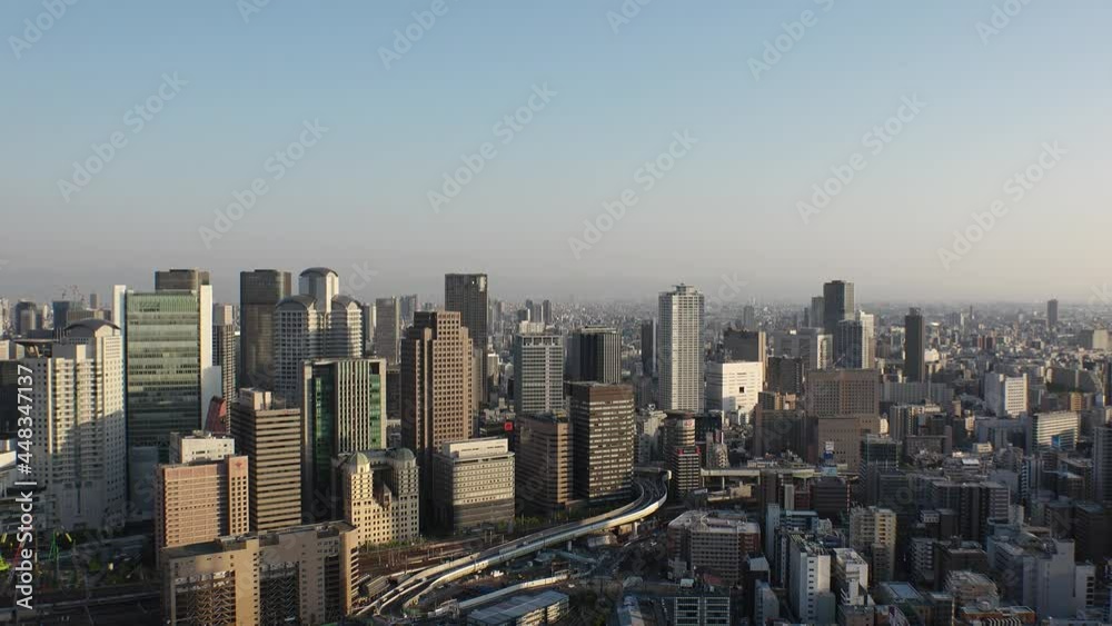 UMEDA, OSAKA, JAPAN : Aerial high angle sunset view of CITYSCAPE of OSAKA. View of buildings and street around Osaka and Umeda station. Wide view real time shot in dusk.