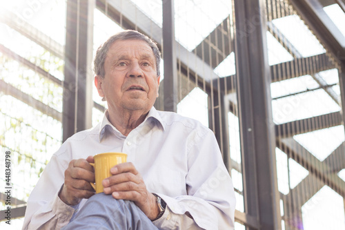 Smiling senior man enjoying in morning coffee