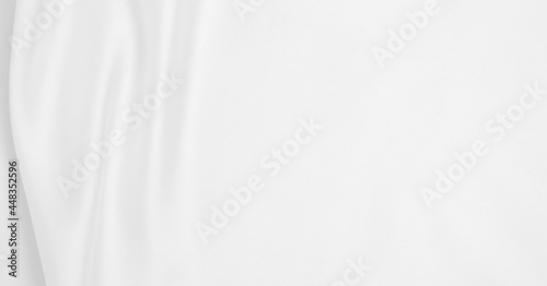 Smooth elegant white silk or satin luxury cloth texture as wedding background. Luxurious background design