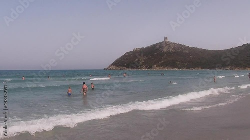 People by the sea walking on the shore