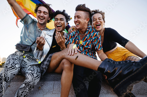 Young people celebrating gay pride outdoors photo