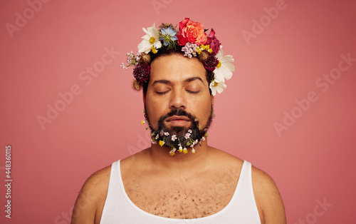 Gay man with flowers on head and beard