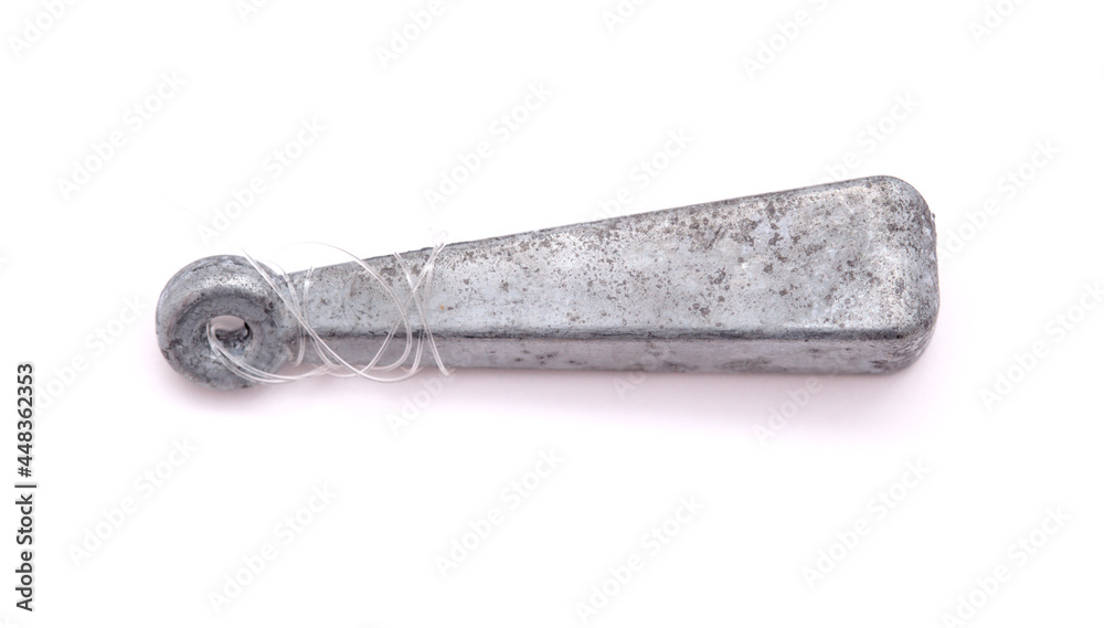 Old lead sinker with a bit of line still attached, isolated on white Old lead sinker with a bit of line still attached, isolated on white
