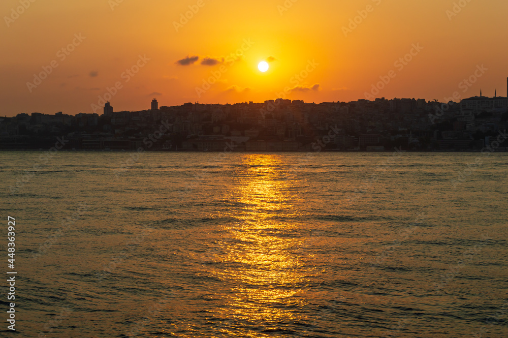 Fiery Sunset sky over sea in the evening with orange sunlight(Istanbul)
