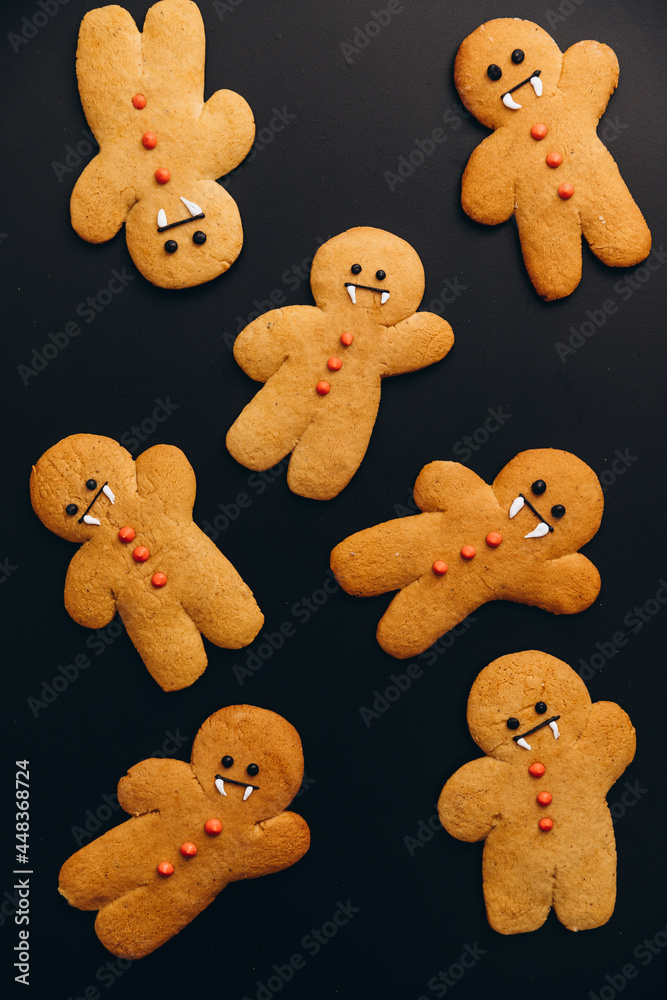 Scary halloween cookies, selective focus decoration on the black background. Halloween style Scary halloween cookies, selective focus decoration on the black background. Halloween style