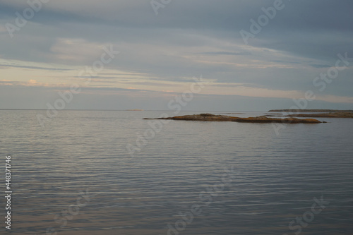 Fotografija Sunset over the sea and calm water