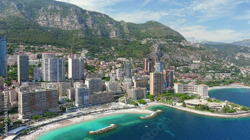 Monte Carlo, Monaco. Aerial view of famous city towering over Mediterranean Sea, modern high-rise buildings, Les Plages beaches  - landscape panorama of Europe from above photo