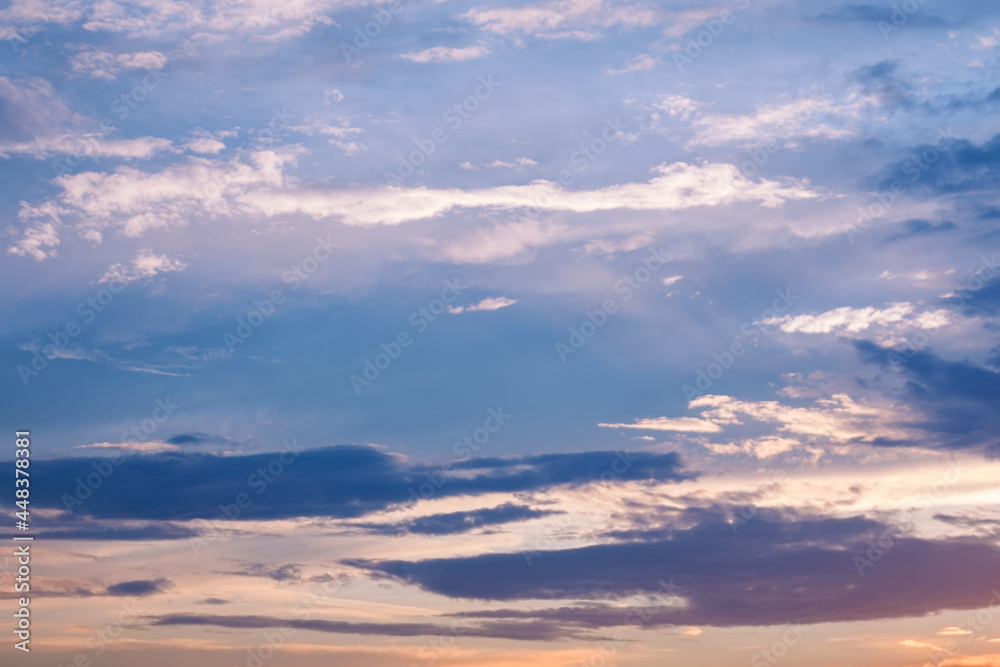 Morning sky with clouds in soft pastel colors. Beautiful natural view of free space. Lovely sunrise background for energy boost and motivation.
