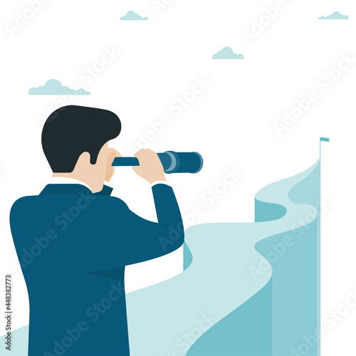 Business man holding telescope standing on top of mountain looking to success in career