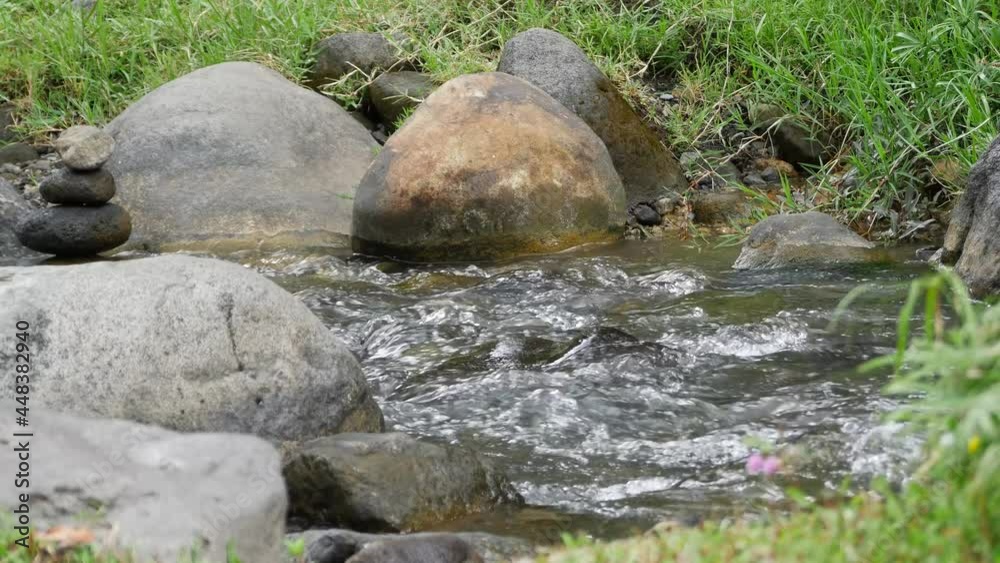 The water flows clear in the river valley mountains in the middle of the cool forest The water flows clear in the river valley mountains in the middle of the cool forest