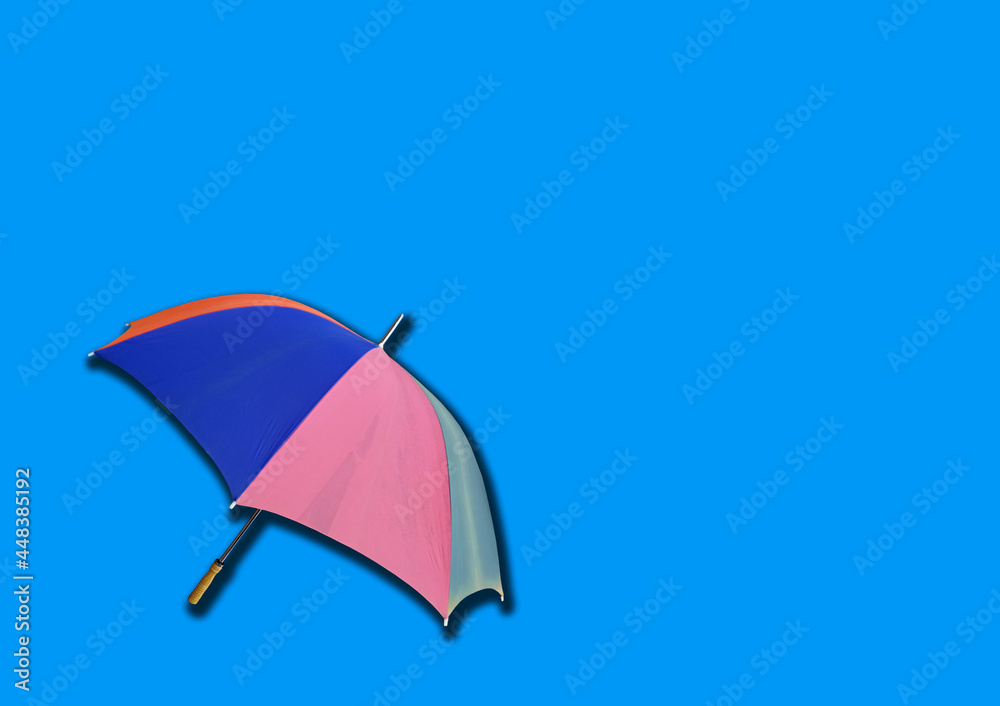 Closeup, Single rainbow umbrella isolated on white background for stock photo or design, invesment, business, summer concept
