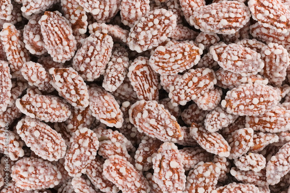 Background of dried sweet almonds placer bright snacks; dried fruits