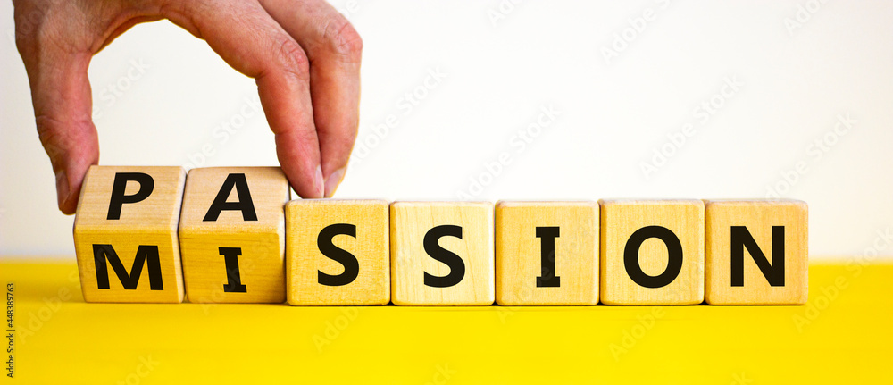 Do your mission with passion. Businessman turns wooden cubes and ...
