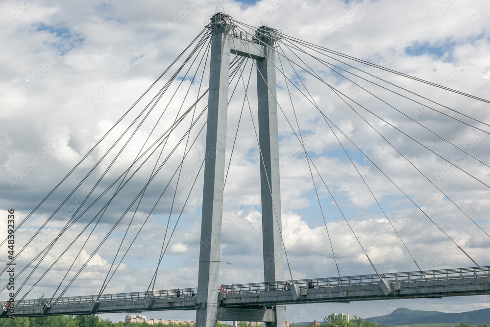 Fototapeta premium Cable-stayed bridge against the backdrop of beautiful clouds