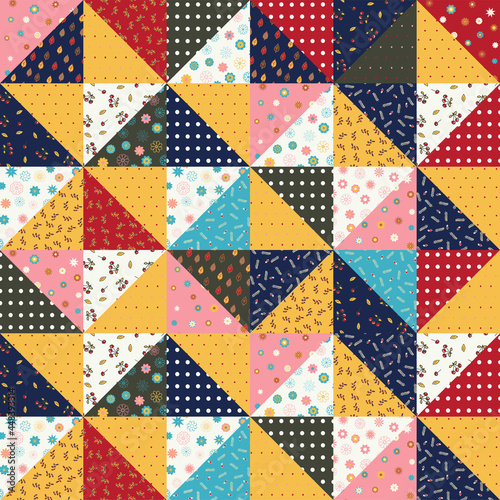 Seamless pattern of a patchwork quilt made from pieces of fabric with different patterns. Floral ornament, polka dots, autumn colors.