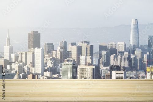 Blank wooden table top with beautiful San Francisco skyline at daytime on background, mockup © Pixels Hunter