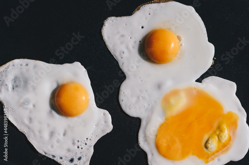 fried egg on a black background