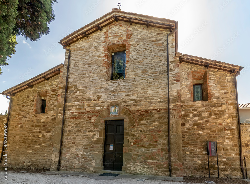 The facade of the ancient Pieve di San Cristoforo in the historic center of Passignano sul Trasimeno, Italy