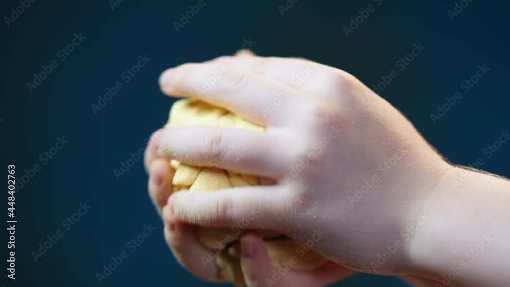 Kid's hands playing with dough․ Close up shot of unrecognizable girl hands kneading raw dough, close up Kid's hands playing with dough․ Close up shot of unrecognizable girl hands kneading raw dough, close up