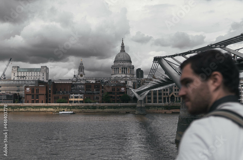 Obraz na płótnie London UK - August 1st 2021: St Paul's Cathedral and Millenium bridge in London during a cloudy day w salonie