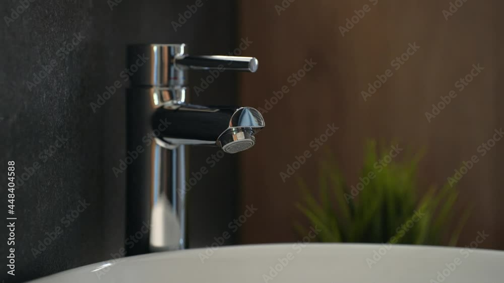 Boy washes his hands carefully, using soap and water to have excellent personal hygiene and to prevent infections caused by contact with previously used objects Boy washes his hands carefully, using soap and water to have excellent personal hygiene and to prevent infections caused by contact with previously used objects