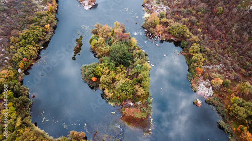 amazing aerial view of foggy morning river and colorful trees. drone shot