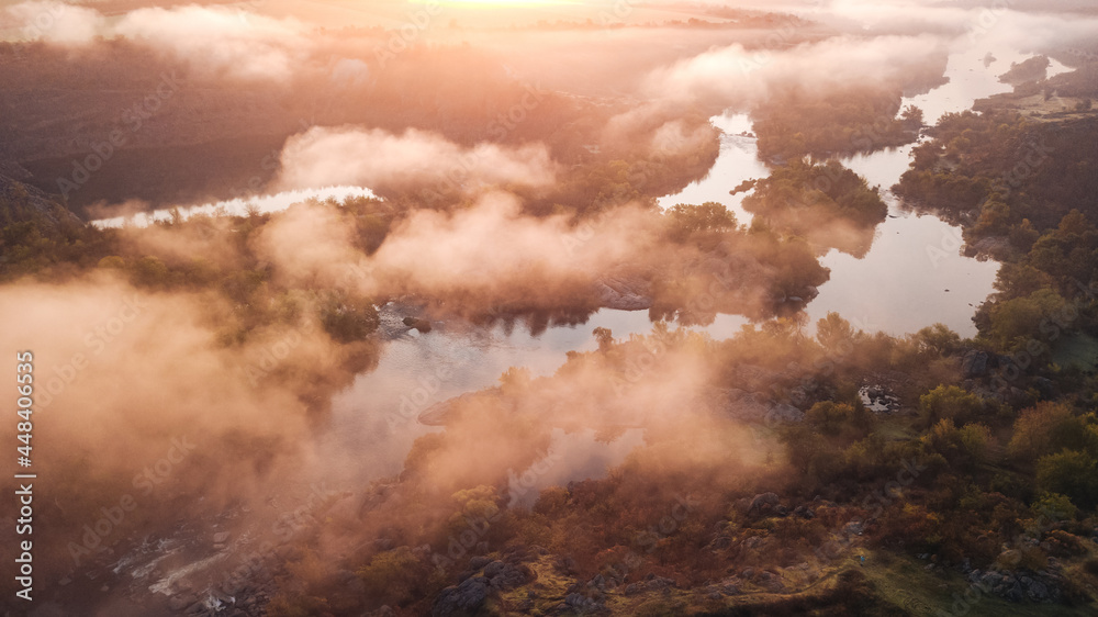 amazing aerial view of foggy morning river and colorful trees. drone shot