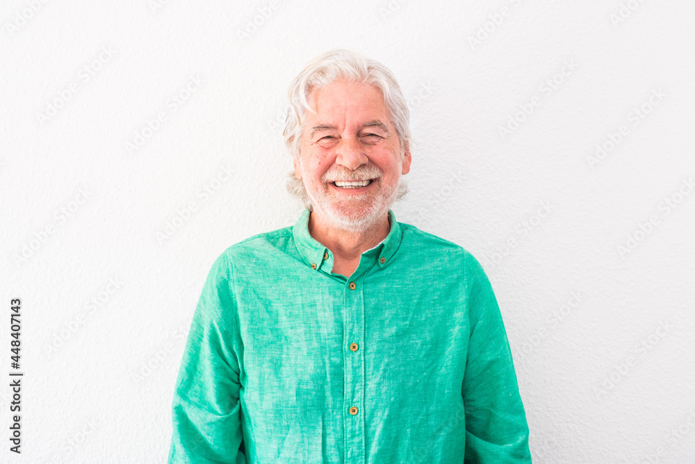 portrait of one old and mature man looking at the camera smiling and laughing - happy senior with white background portrait of one old and mature man looking at the camera smiling and laughing - happy senior with white background