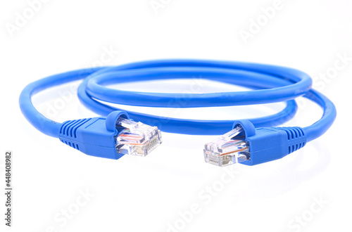 blue LAN cable that is coiled in a circle on white background closeup