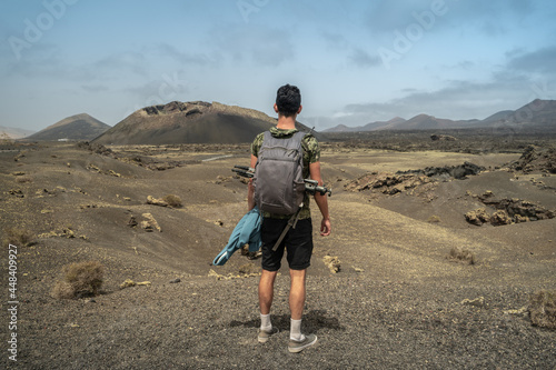 Young man contemplates the desert landscape of the 