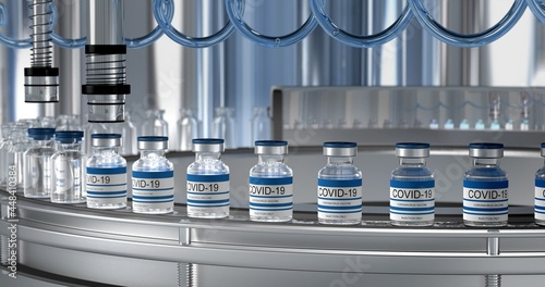 SARS-COV-2 COVID-19 Mass production of coronavirus vaccine, a machine pours the vaccine, seals bottle caps into ampoules moving along a pharmaceutical conveyor belt in a research laboratory.