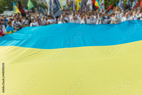 Crown of people with Ukrainian flag on March of defenders, parade in Kyiv, dedicated to the Independence Day of Ukraine, 29th anniversary