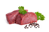 raw meat beef with green parsley and black pepper isolated on white background close up