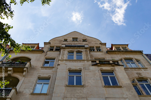 Facade of historical houses in the old town of Dresden. Many different brick houses stand in a row. Narrow alley with special buildings.