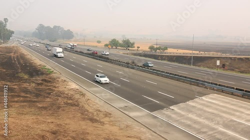  Traffic on northern califonia freeway during fire season with thick smoke in air. photo
